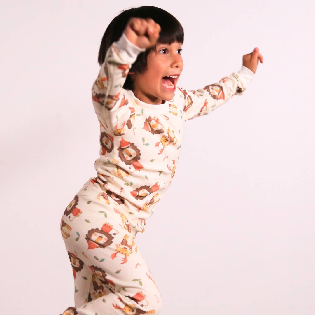 Mukupati’s Lions and Tigers Christmas Organic Pajamas for a holiday season filled with warmth, joy, and sustainability!